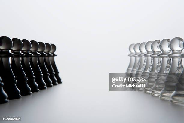 pawn of chess that stands face to face - friend enemy stock pictures, royalty-free photos & images