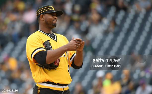 Michael Feliz of the Pittsburgh Pirates reacts after a wild pitch and an error in the sixth inning during the game against the Milwaukee Brewers at...