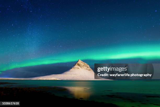 dancing aurora kp5 and a meteor over mt.kirkjufell, iceland - snaefellsjokull glacier stock pictures, royalty-free photos & images