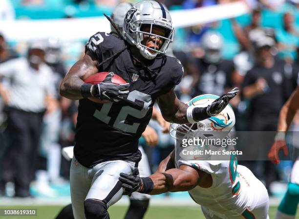 Martavis Bryant of the Oakland Raiders runs for yardage during the second quarter against the Miami Dolphins at Hard Rock Stadium on September 23,...