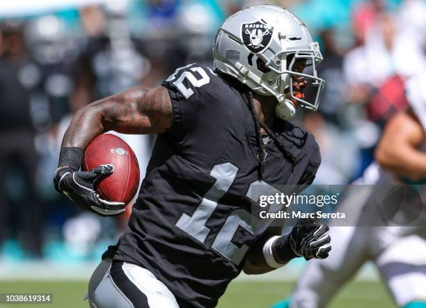 Martavis Bryant of the Oakland Raiders runs for yardage during the second quarter against the Miami Dolphins at Hard Rock Stadium on September 23,...