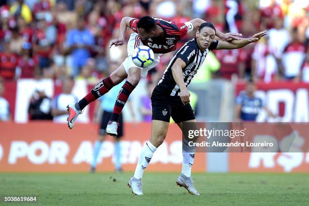 Rever of Flamengo struggles for the ball with Ricardo Oliveira of Atletico-MG during the match between Flamengo and Atletico-MG as part of...