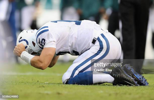 Quarterback Andrew Luck of the Indianapolis Colts reacts after being sacked by defensive end Derek Barnett of the Philadelphia Eagles · on fourth and...