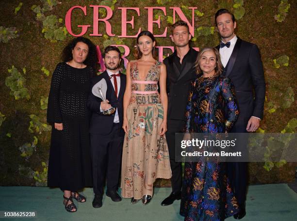 Sara Maino, Gilberto Calzolari, winner of the Franca Sozzani GCC Award for Best Emerging Designer, a model wearing the winning design, Jeremy Irvine,...