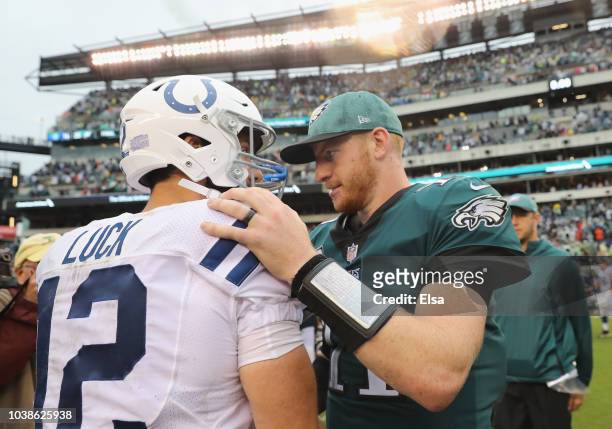 Quarterback Andrew Luck of the Indianapolis Colts talks with quarterback Carson Wentz of the Philadelphia Eagles after the Eagles 20-16 win at...
