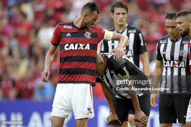 Rever of Flamengo makes a joke with Leonardo Silva of Atletico-MG during the match between Flamengo and Atletico-MG as part of Brasileirao Series A...