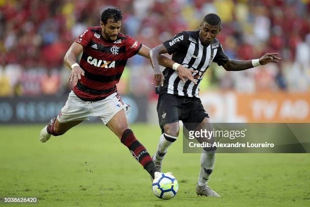 Henrique Dourado of Flamengo struggles for the ball with Emerson Leite of Atletico-MG during the match between Flamengo and Atletico-MG as part of...