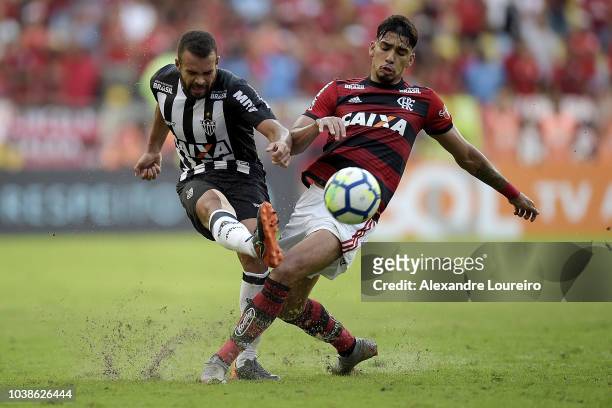 Lucas Paqueta of Flamengo struggles for the ball with José Welison of Atletico-MG during the match between Flamengo and Atletico-MG as part of...