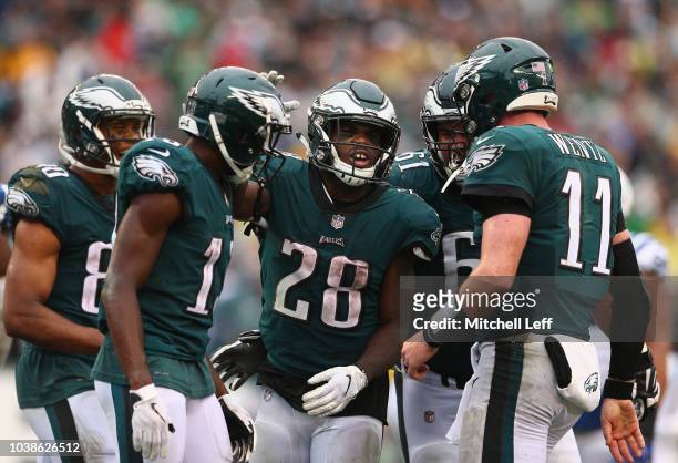 Running back Wendell Smallwood of the Philadelphia Eagles celebrates his game-winning touchdown with teammates Jordan Matthews, wide receiver Nelson...