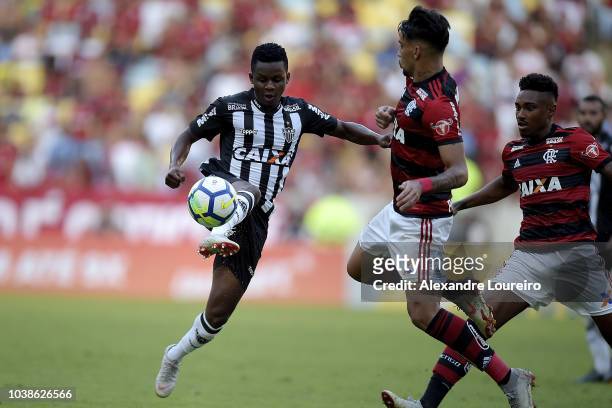 Lucas Paqueta of Flamengo struggles for the ball with Cazares of Atletico-MG during the match between Flamengo and Atletico-MG as part of Brasileirao...