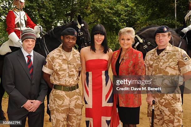 Musician and performer Linzi Stoppard poses with Trooper Clifford O'Farrell , Trooper Corey Mapp , Angela Rippon and LCpl Martyn Cromton with...
