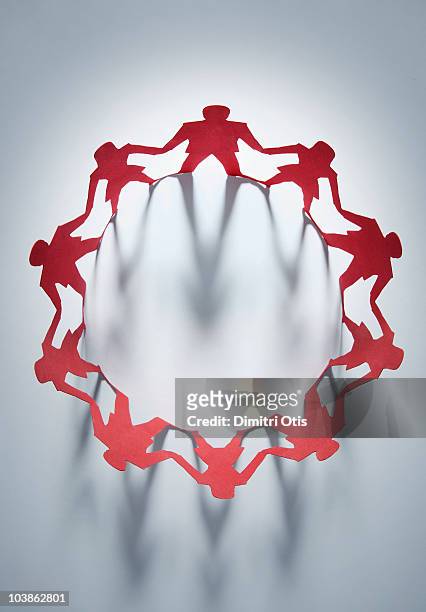 circle of red paper cut-out figures - ring binder bildbanksfoton och bilder