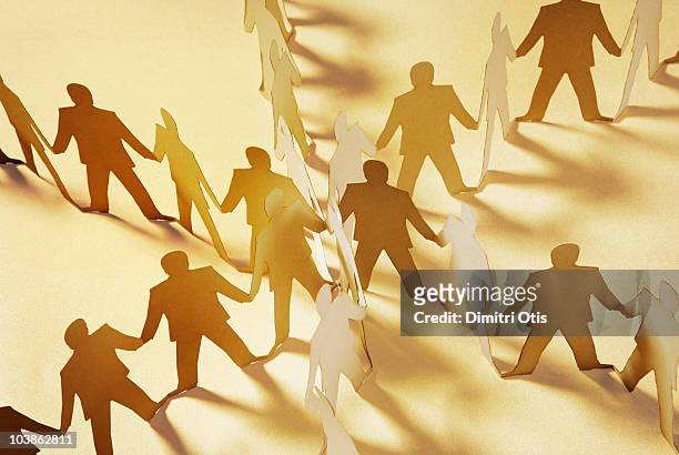 paper cut-out figures radiating from the center - staff bonding stock pictures, royalty-free photos & images