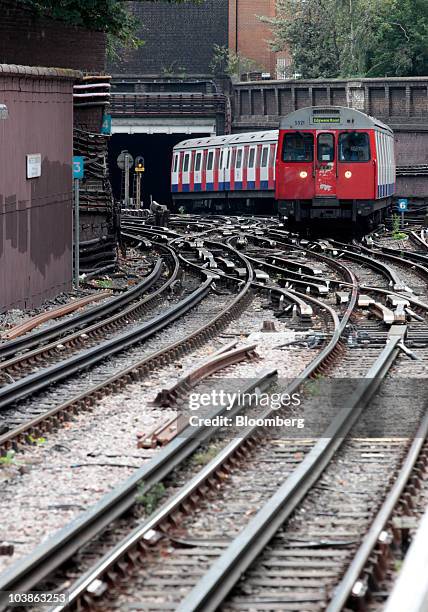 Tube train travels along above ground tracks on the London Underground network in London, U.K., on Monday, Sept. 6, 2010. London's 3.5 million Tube...