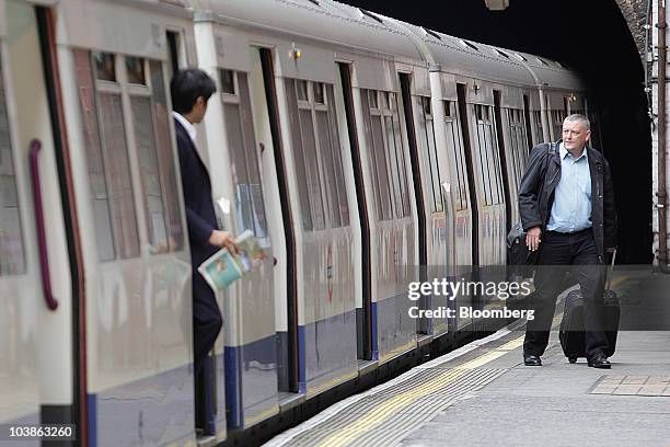 Passenger exits a Tube train on the London Underground in London, U.K., on Monday, Sept. 6, 2010. London's 3.5 million Tube travelers face disruption...