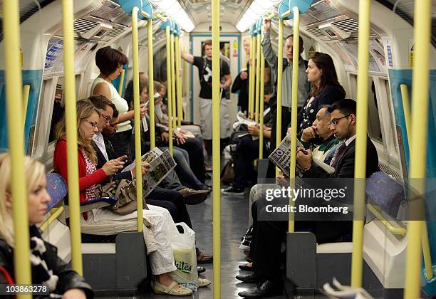 Passengers travel on a Tube train on the London Underground in London, U.K., on Monday, Sept. 6, 2010. London's 3.5 million Tube travelers face...