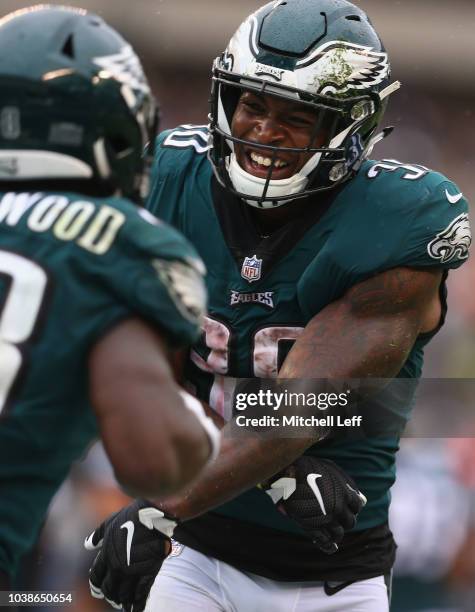 Running back Wendell Smallwood of the Philadelphia Eagles celebrates his game-winning touchdown with teammate running back Corey Clement against the...