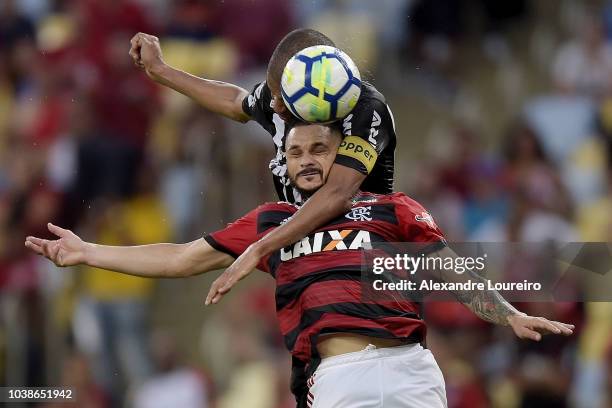 Para of Flamengo struggles for the ball with Leonardo Silva of Atletico-MG during the match between Flamengo and Atletico-MG as part of Brasileirao...