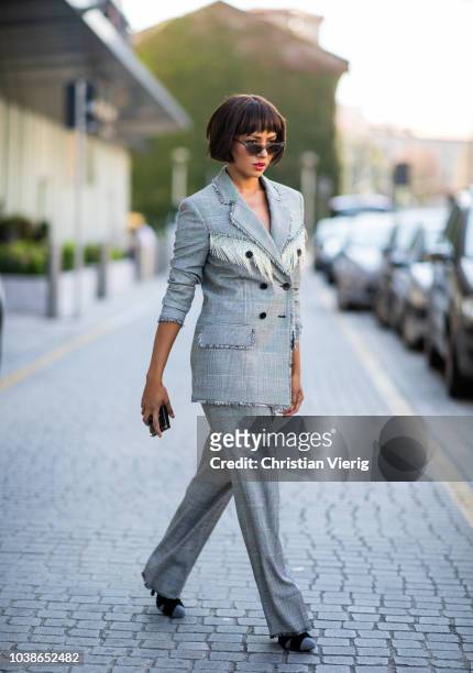 American actress Kat Graham is seen wearing grey checked suit MSGM during Milan Fashion Week Spring/Summer 2019 on September 23, 2018 in Milan, Italy.