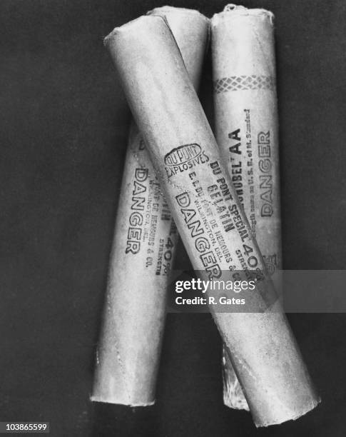 Close-up view of three sticks of dynamite produced by DuPont Explosives, USA, circa 1950. Each stick has 'Du Pont Explosives, Du Pont Special...