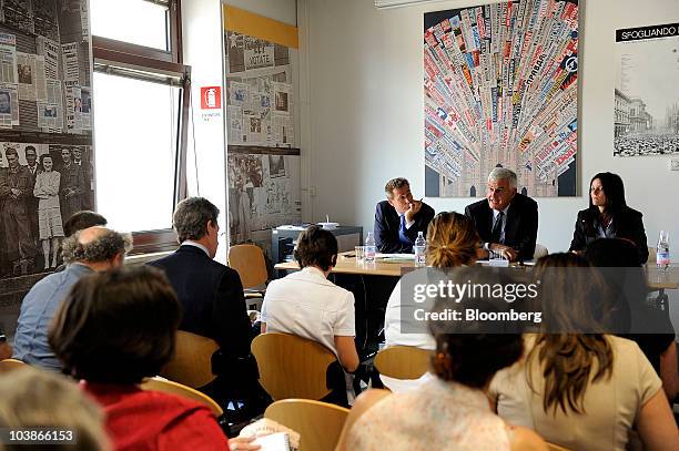 Alessandro Profumo, chief executive officer of Unicredit SpA, center on panel, speaks during a news conference in Milan, Italy, on Monday, Sept. 6,...