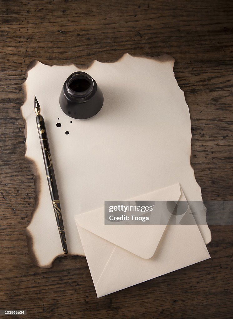 Blank paper with pen and ink