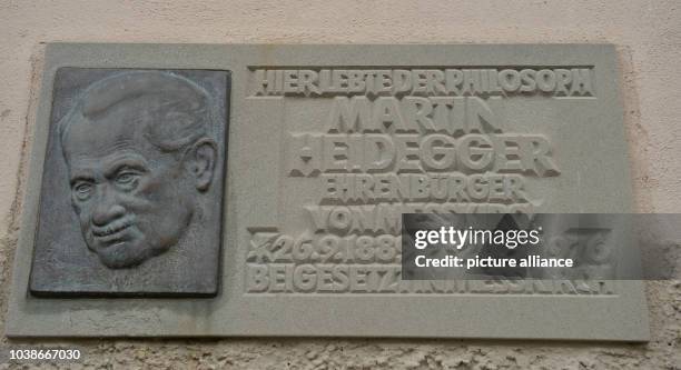 Commemorative plaque hangs attached to the facade of the childhood home of German philosopher Martin Heidegger in Messkirch, Germany, 22 September...