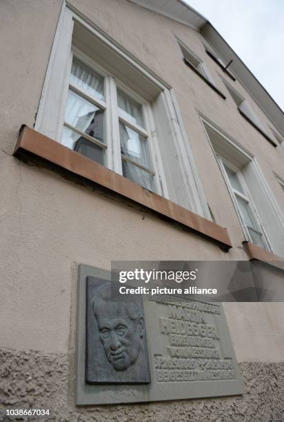 Commemorative plaque hangs attached to the facade of the childhood home of German philosopher Martin Heidegger in Messkirch, Germany, 22 September...