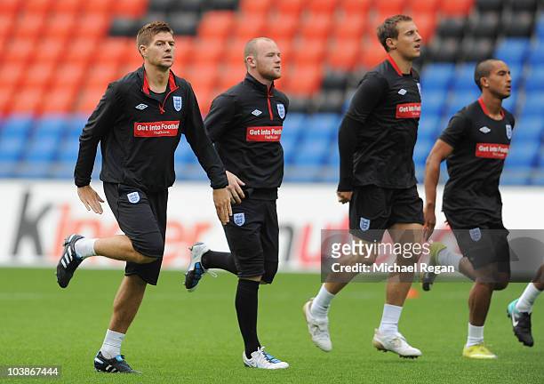 Steven Gerrard, Wayne Rooney, Phil Jagielka and Theo Walcott warm up during the England training session ahead of their UEFA EURO 2012 qualifying...