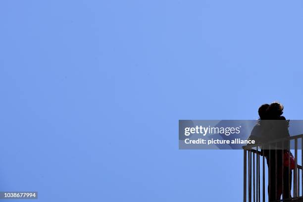 Couple stands at the old port of Marseille, France, 24 June 2016. With its 85,000 residents Marseille is the second biggest city in France after...