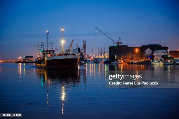 night view on harbor of saint-nazaire, pays de la loire region, france - saint nazaire stock pictures, royalty-free photos & images