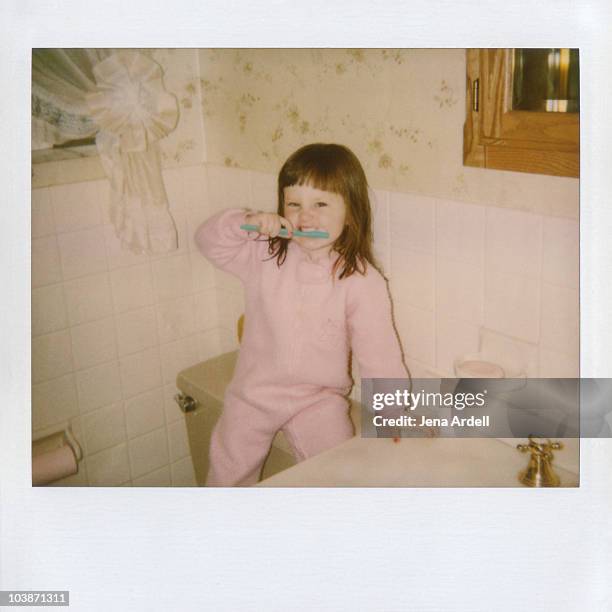 polaroid of a little girl brushing her teeth - 1980s hairstyles stock pictures, royalty-free photos & images