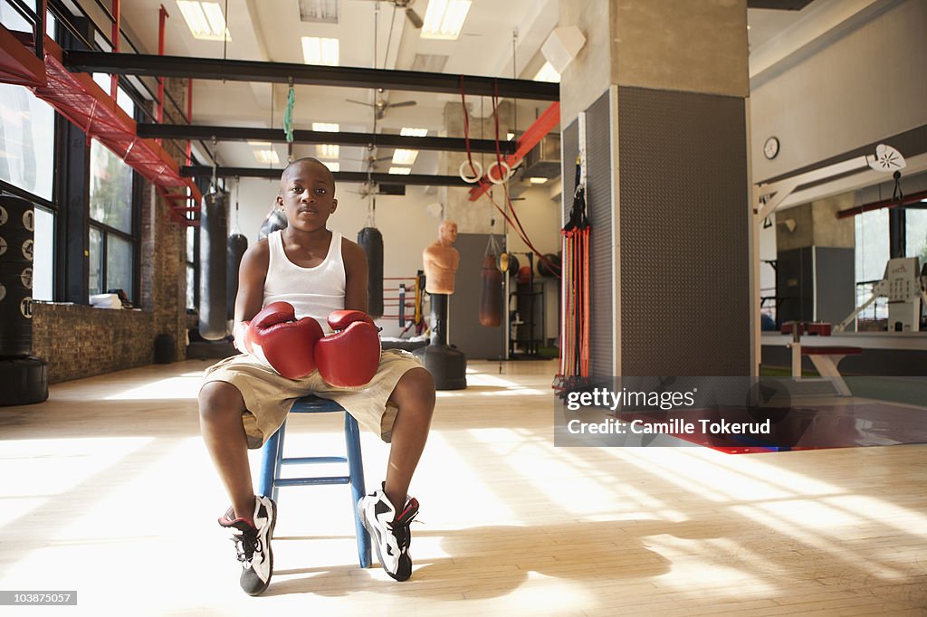 Boy wearing boxing gloves 