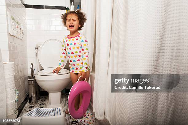 little girl crying in the bathroom - childrens closet stockfoto's en -beelden