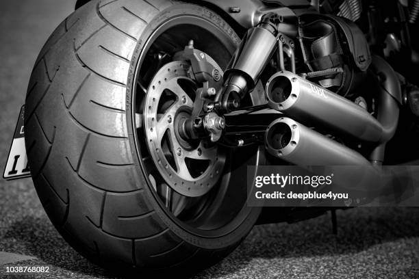 modern motorcycle with huge rear wheel - 4 wheel motorbike stock pictures, royalty-free photos & images