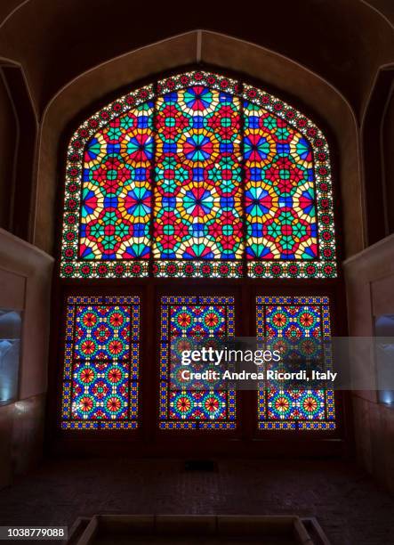 colorful stained glass window in dolat abad garden, yazd, iran - yazd stockfoto's en -beelden