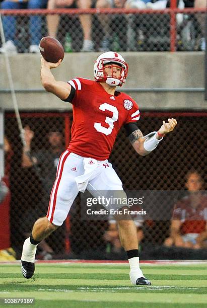 Taylor Martinez of the Nebraska Cornhuskers passes the ball down field against the Western Kentucky Hilltoppers during first half action of their...