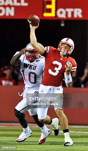 Taylor Martinez of the Nebraska Cornhuskers passes the ball down field against the Western Kentucky Hilltoppers during first half action of their...