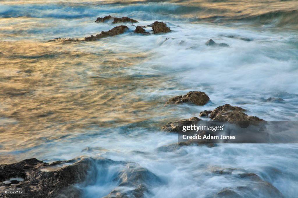 Ocean in motion at sunset