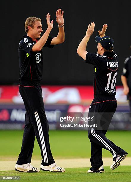 Stuart Broad of England celebrates with team mate Eoin Morgan after taking the wicket of Shahid Afridi of Pakistan during the 2nd NatWest T20...