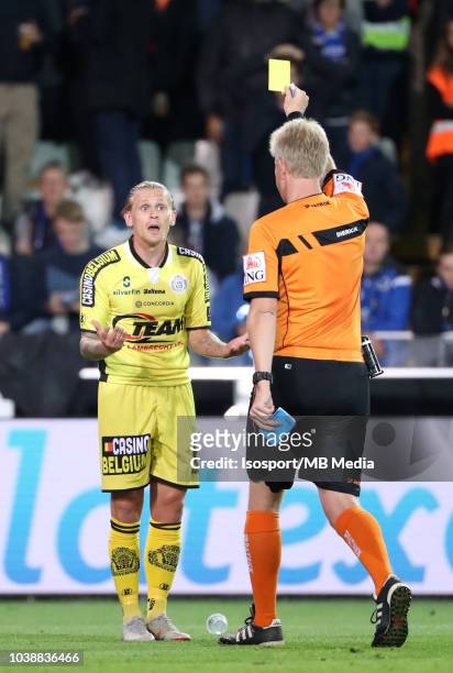 Ari Freyr Skulason receives a yellow card from Christof Dierick during the Jupiler Pro League match between Club Brugge and KSC Lokeren OV at Jan...