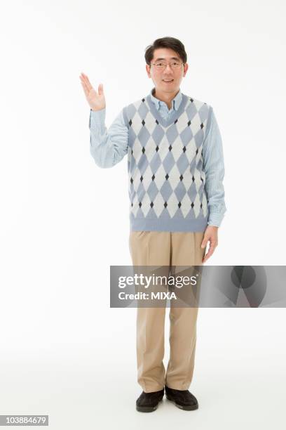 portrait of mature man - sweater vest stock pictures, royalty-free photos & images