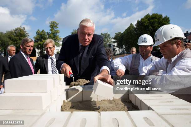 Investor Klaus-Michael Kuehne participates in the corner stone ceremony for the luxury hotel 'The Fontenay' in Hamburg, Germany, 14 August 2014....