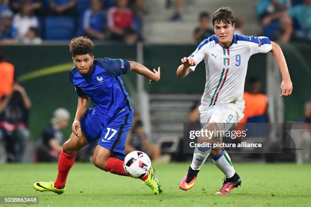 Italy's Andrea Favilli and France's Denis Will Poha vie for the ball during the UEFA European Under-19 Championship final soccer match between France...