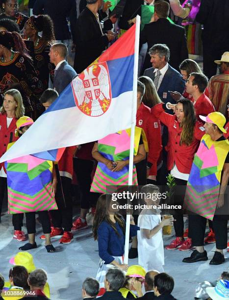 Ivana Andjusic Maksimovic carries the flag of Serbia during the opening ceremony of the Rio 2016 Olympic Games at the Maracana stadium in Rio de...