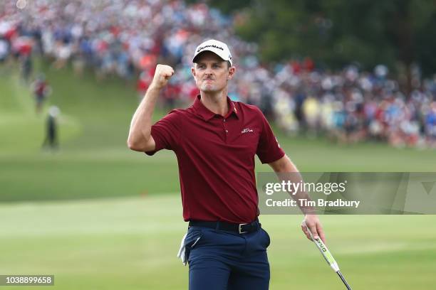 Justin Rose of England celebrates on the 18th green prior to winning the 2018 FedEx Cup during the final round of the TOUR Championship at East Lake...