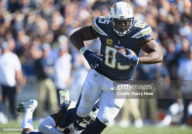 Antonio Gates of the Los Angeles Chargers is tackled by Marqui Christian of the Los Angeles Rams during the fourth quarter of the game at Los Angeles...