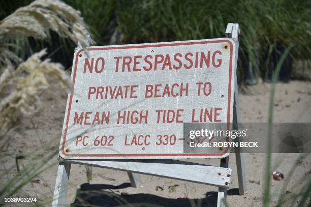 No Tresspassing signs are posted on the beach-facing side of multi-million dollar homes in Malibu, California, September 18, 2018. - California's...