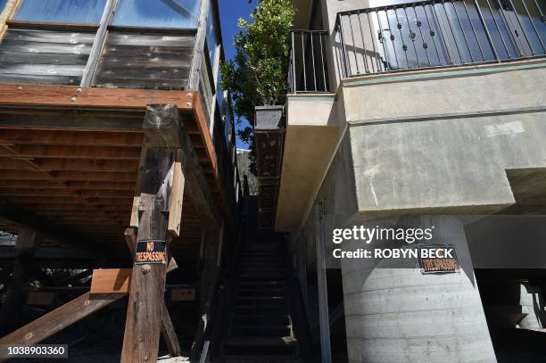 No Tresspassing signs are posted on the beach-facing side of multi-million dollar homes in Malibu, California, September 18, 2018. - California's...
