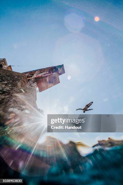 In this handout image provided by Red Bull, Andy Jones of the USA dives from the 27 metre platform during the last competition day of the seventh and...